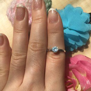 Silver-colored Ring with a Blue Gem